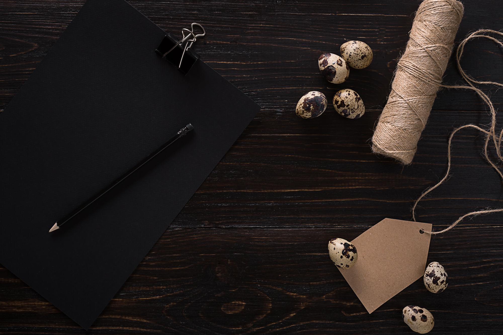 Pricing visual: thread and needles on dark background